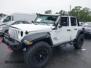 2018 Jeep Wrangler Unlimited Sport with VIN 1C4HJXDG0JW233696, listed as a IAAI auction lot 42523474 with 66,961 mi miles and . Bid and sale history available at DreamBid. Image 6.