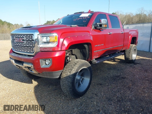 2018 GMC Sierra 2500HD Denali z VIN 1GT12UEY6JF272619, wystawiony jako IAAI lot #41743216 z przebiegiem 165 231 mil mil oraz . Historia ofert i sprzedaży dostępna na DreamBid. Obrazek 2.