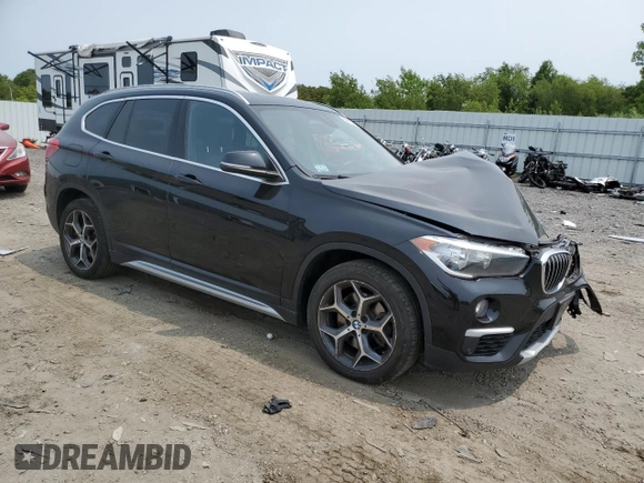 2018 BMW X1 xDrive28i with VIN WBXHT3C36J3H29952, listed as a Copart auction lot 59679285 with 75,220 mi miles and Salvage title. Bid and sale history available at DreamBid. Image 4.