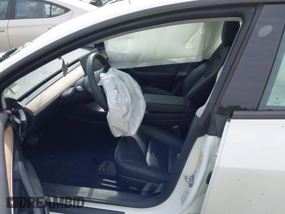 2023 Tesla Model 3 with VIN 5YJ3E1EA4PF644621, listed as a IAAI auction lot 42280312 with 41,262 mi miles and . Bid and sale history available at DreamBid. Image 5.