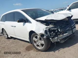 2012 Honda Odyssey Touring with VIN 5FNRL5H94CB080195, listed as a IAAI auction lot 42494341 with 188,822 mi miles and . Bid and sale history available at DreamBid. Image 1.