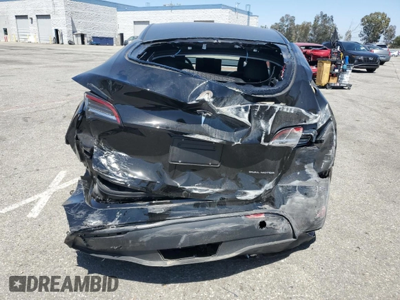 2024 Tesla Model Y Long Range with VIN 7SAYGDEE0RF123793, listed as a Copart auction lot 57177305 with 20,053 mi miles and Salvage title. Bid and sale history available at DreamBid. Image 6.