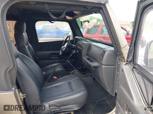 2003 Jeep Wrangler SE with VIN 1J4FA29193P302424, listed as a IAAI auction lot 42179494 with 120,712 mi miles and . Bid and sale history available at DreamBid. Image 5.