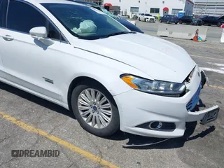 2016 Ford Fusion Energi SE Luxury with VIN 3FA6P0PU7GR206589, listed as a IAAI auction lot 42002565 with 215,789 mi miles. Bid and sale history available at carsss.com. Image 13.