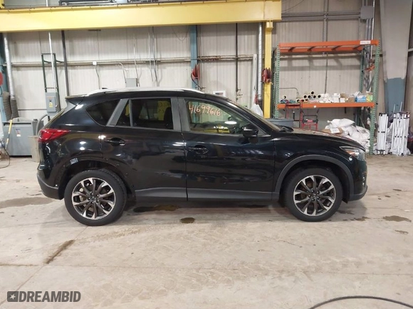 2016 Mazda CX-5 Grand Touring with VIN JM3KE2DY9G0635368, listed as a IAAI auction lot 41699616 with 240,619 mi miles. Bid and sale history available at carsss.com. Image 14.