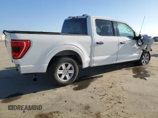 2021 Ford F-150 XL with VIN 1FTEW1CP8MFD11312, listed as a Copart auction lot 88754605 with 142,224 mi miles and Salvage title. Bid and sale history available at DreamBid. Image 3.