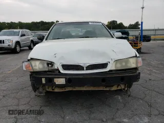 2002 Infiniti G20 Luxury z VIN JNKCP11AX2T500141, wystawiony jako Copart lot #70648434 z przebiegiem 196 559 mil mil oraz Szkody całkowita. Historia ofert i sprzedaży dostępna na DreamBid. Obrazek 5.