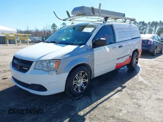 2014 Ram Cargo Van Tradesman with VIN 2C4JRGAG2ER353111, listed as a IAAI auction lot 41667424 with 200,798 mi miles. Bid and sale history available at carsss.com. Image 2.