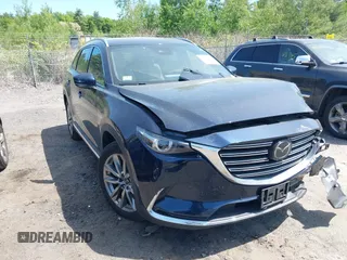 2019 Mazda CX-9 Grand Touring z VIN JM3TCBDY6K0329361, wystawiony jako IAAI lot #42373045 z przebiegiem 51 828 mil mil oraz . Historia ofert i sprzedaży dostępna na DreamBid. Obrazek 1.