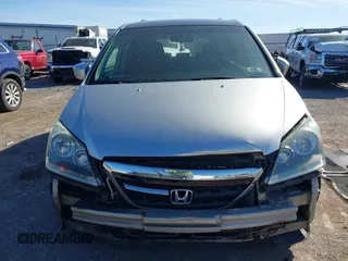 2005 Honda Odyssey EX z VIN 5FNRL38465B411189, wystawiony jako IAAI lot #42310199 z przebiegiem 304 142 mil mil oraz . Historia ofert i sprzedaży dostępna na DreamBid. Obrazek 12.
