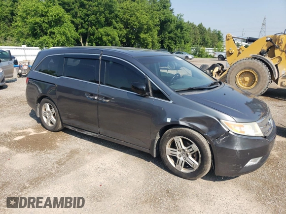2012 Honda Odyssey Touring with VIN 5FNRL5H90CB505590, listed as a Copart auction lot 62566715 with 323,092 mi miles and Clean title. Bid and sale history available at DreamBid. Image 4.