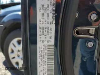2015 Dodge Journey SE z VIN 3C4PDCAB8FT553477, wystawiony jako Copart lot #58097985 z przebiegiem 145 570 mil mil oraz Szkoda całkowita • Salvage title. Historia ofert i sprzedaży dostępna na DreamBid. Obrazek 13.
