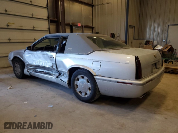2000 Cadillac Eldorado Touring ETC z VIN 1G6ET1294YU180525, wystawiony jako Copart lot #89253455 z przebiegiem 102 230 mil mil oraz Nie do naprawy • Non repairable. Historia ofert i sprzedaży dostępna na DreamBid. Obrazek 2.