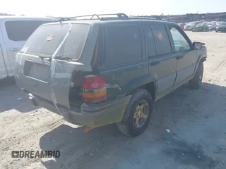 1996 Jeep Grand Cherokee Laredo with VIN 1J4FX58S9TC300710, listed as a IAAI auction lot 42073391 with 1 mi miles. Bid and sale history available at carsss.com. Image 4.
