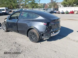 2024 Tesla Model Y with VIN 7SAYGDED3RF092501, listed as a IAAI auction lot 40820923 with 4,688 mi miles and . Bid and sale history available at DreamBid. Image 3.