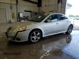2009 Pontiac G6 z VIN 1G2ZL577894230250, wystawiony jako Copart lot #63275235 z przebiegiem 166 792 mil mil oraz Czysty tytuł • Clean title. Historia ofert i sprzedaży dostępna na DreamBid. Obrazek 1.