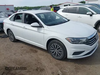 2021 Volkswagen Jetta S z VIN 3VWC57BU0MM021874, wystawiony jako IAAI lot #42124747 z przebiegiem 89 887 mil mil oraz . Historia ofert i sprzedaży dostępna na DreamBid. Obrazek 1.