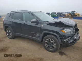 2018 Jeep Compass Trailhawk with VIN 3C4NJDDB6JT207289, listed as a Copart auction lot 56013675 with 83,385 mi miles and Salvage title. Bid and sale history available at DreamBid. Image 4.