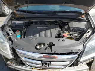 2005 Honda Odyssey Touring z VIN 5FNRL38835B071258, wystawiony jako Copart lot #57878295 z przebiegiem 143 474 mil mil oraz Szkoda całkowita • Salvage title. Historia ofert i sprzedaży dostępna na DreamBid. Obrazek 12.
