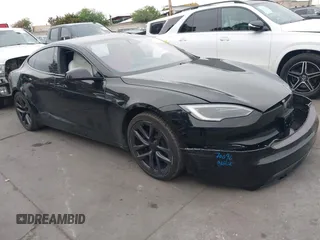 2022 Tesla Model S with VIN 5YJSA1E55NF474342, listed as a IAAI auction lot 41870994 with 33,804 mi miles and . Bid and sale history available at DreamBid. Image 1.