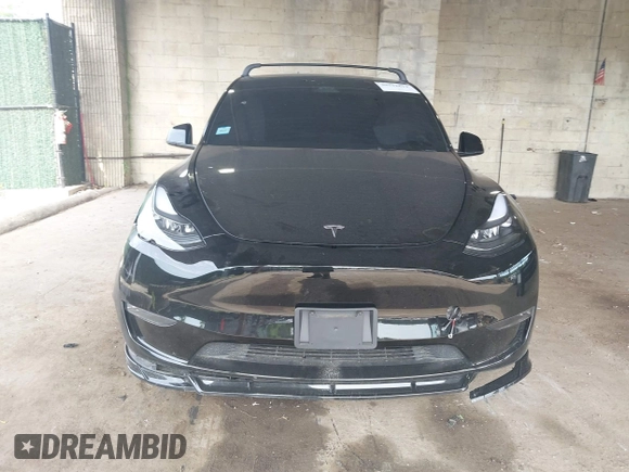 2023 Tesla Model Y Long Range with VIN 7SAYGDEE3PA185778, listed as a IAAI auction lot 39721611 with 11,986 mi miles and . Bid and sale history available at DreamBid. Image 12.