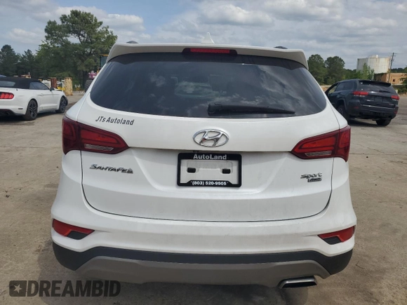2018 Hyundai Santa Fe 2.4L z VIN 5NMZUDLB9JH095157, wystawiony jako Copart lot #53546725 z przebiegiem 128 840 mil mil oraz Szkoda całkowita • Salvage title. Historia ofert i sprzedaży dostępna na DreamBid. Obrazek 6.