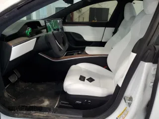 2024 Tesla Model S with VIN 5YJSA1E56RF538488, listed as a Copart auction lot 54702885 with 9,470 mi miles and Salvage title. Bid and sale history available at DreamBid. Image 7.