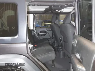 2018 Jeep Wrangler Unlimited Sport S with VIN 1C4HJXDG5JW126496, listed as a IAAI auction lot 42390584 with 163,476 mi miles and . Bid and sale history available at DreamBid. Image 8.