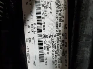 2012 Ford Focus SE z VIN 1FAHP3K24CL407570, wystawiony jako Copart lot #56002135 z przebiegiem 122 730 mil mil oraz Szkoda całkowita • Salvage title. Historia ofert i sprzedaży dostępna na DreamBid. Obrazek 13.