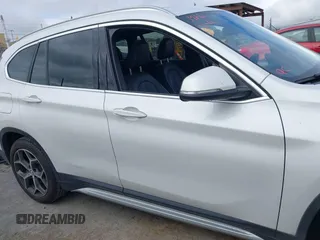 2018 BMW X1 sDrive28i with VIN WBXHU7C38J5L05985, listed as a IAAI auction lot 42014649 with 77,082 mi miles. Bid and sale history available at carsss.com. Image 14.