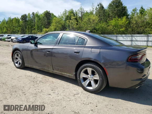 2015 Dodge Charger SXT with VIN 2C3CDXHG8FH794623, listed as a Copart auction lot 52000144 with 145,624 mi miles and Salvage Title. Bid and sale history available at DreamBid. Image 2.