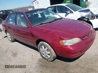 1999 Toyota Corolla VE z VIN 2T1BR12EXXC219058, wystawiony jako IAAI lot #41895681 z przebiegiem 270 062 mil mil oraz . Historia ofert i sprzedaży dostępna na DreamBid. Obrazek 1.