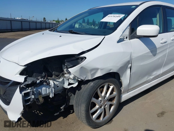 2012 Mazda 5 Touring with VIN JM1CW2CL7C0140452, listed as a IAAI auction lot 41970209 with 92,069 mi miles and . Bid and sale history available at DreamBid. Image 6.