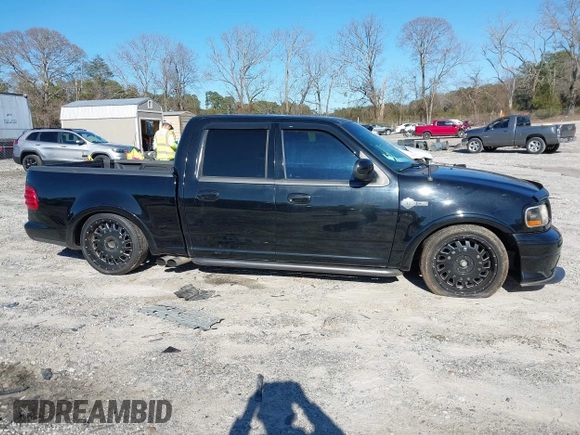 2002 Ford F-150 Harley Davidson with VIN 1FTRW07312KC24102, listed as a IAAI auction lot 41591917 with 1 mi miles. Bid and sale history available at carsss.com. Image 14.