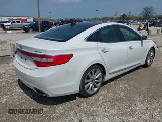 2014 Hyundai Azera Limited z VIN KMHFH4JG2EA373608, wystawiony jako IAAI lot #42125063 z przebiegiem 121 111 mil mil oraz . Historia ofert i sprzedaży dostępna na DreamBid. Obrazek 4.
