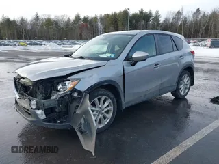 2014 Mazda CX-5 Grand Touring with VIN JM3KE2DY8E0304911, listed as a IAAI auction lot 41672197 with 77,523 mi miles. Bid and sale history available at carsss.com. Image 2.