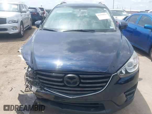 2016 Mazda CX-5 Sport z VIN JM3KE2BY0G0633611, wystawiony jako IAAI lot #42390654 z przebiegiem Nie podano mil oraz . Historia ofert i sprzedaży dostępna na DreamBid. Obrazek 13.