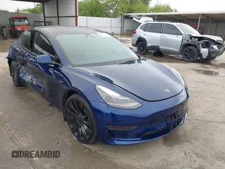2023 Tesla Model 3 Performance z VIN 5YJ3E1ECXPF551538, wystawiony jako IAAI lot #42157417 z przebiegiem 26 511 mil mil oraz . Historia ofert i sprzedaży dostępna na DreamBid. Obrazek 1.