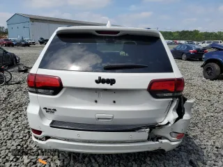 2018 Jeep Grand Cherokee Altitude with VIN 1C4RJFAGXJC122688, listed as a Copart auction lot 61290525 with 106,671 mi miles and Salvage title. Bid and sale history available at DreamBid. Image 6.