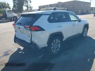 2023 Toyota RAV4 XLE Premium with VIN 2T3C1RFV7PW299428, listed as a IAAI auction lot 42527306 with 9,853 mi miles and . Bid and sale history available at DreamBid. Image 4.