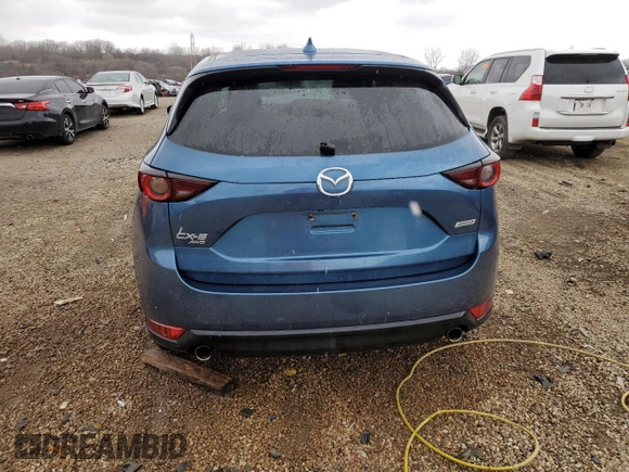 2017 Mazda CX-5 Touring z VIN JM3KFBCL2H0129000, wystawiony jako Copart lot #52107005 z przebiegiem 55 411 mil mil oraz Szkody całkowita. Historia ofert i sprzedaży dostępna na DreamBid. Obrazek 6.