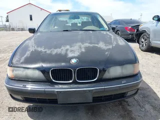1999 BMW 5 Series 528iA with VIN WBADM6331XBY29010, listed as a IAAI auction lot 42103420 with 196,575 mi miles. Bid and sale history available at carsss.com. Image 6.