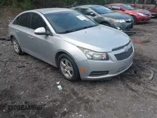 2014 Chevrolet Cruze 1LT with VIN 1G1PC5SB5E7403383, listed as a IAAI auction lot 41960344 with 141,586 mi miles and . Bid and sale history available at DreamBid. Image 1.