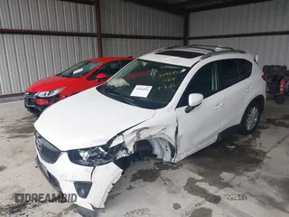 2014 Mazda CX-5 Touring with VIN JM3KE4CY9E0370610, listed as a IAAI auction lot 42016896 with 72,340 mi miles. Bid and sale history available at carsss.com. Image 16.