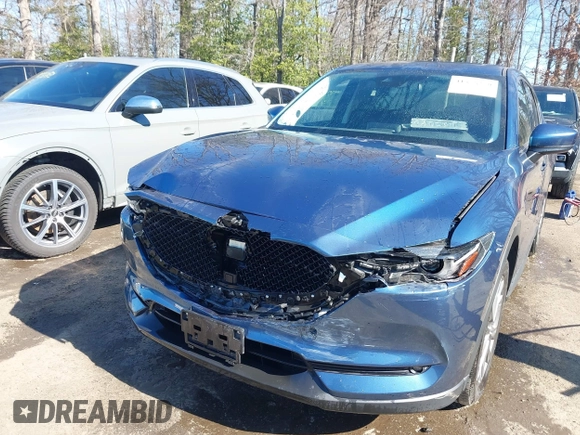 2020 Mazda CX-5 Grand Touring with VIN JM3KFBDM9L0756826, listed as a IAAI auction lot 41866290 with 145,567 mi miles. Bid and sale history available at carsss.com. Image 6.