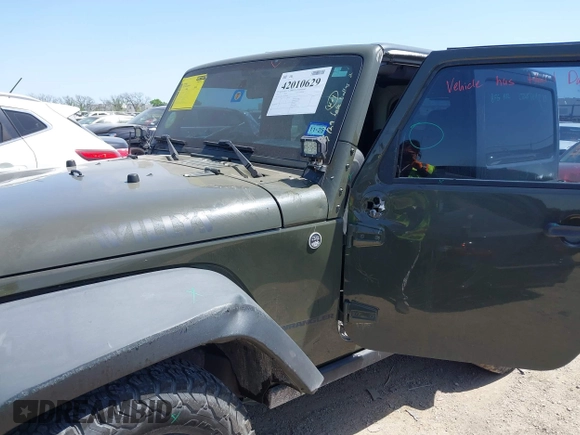 2015 Jeep Wrangler Sport with VIN 1C4AJWAGXFL650428, listed as a IAAI auction lot 42010629 with 80,039 mi miles. Bid and sale history available at carsss.com. Image 6.