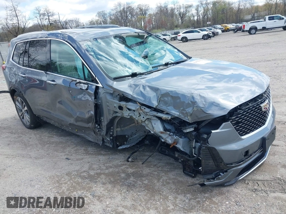 2020 Cadillac XT6 FWD Premium Luxury z VIN 1GYKPCRS9LZ129763, wystawiony jako IAAI lot #42052532 z przebiegiem 57 670 mil mil oraz . Historia ofert i sprzedaży dostępna na DreamBid. Obrazek 1.