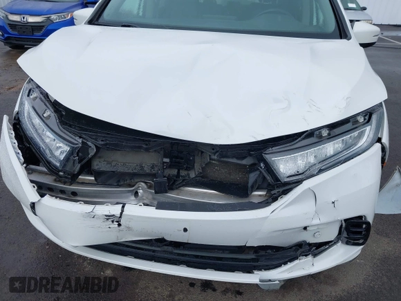 2022 Honda Odyssey Touring with VIN 5FNRL6H8XNB057293, listed as a IAAI auction lot 41826014 with 30,454 mi miles and . Bid and sale history available at DreamBid. Image 6.