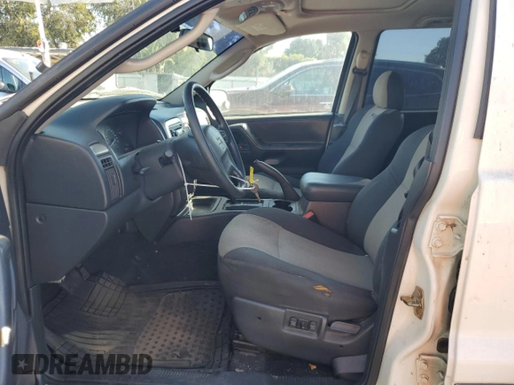 2004 Jeep Grand Cherokee with VIN 1J4GX48JX4C301369, listed as a Copart auction lot 77803094 with 179,404 mi miles and Clean title. Bid and sale history available at DreamBid. Image 7.