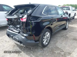 2021 Ford Edge Titanium z VIN 2FMPK3K99MBA16882, wystawiony jako IAAI lot #42214606 z przebiegiem 140 031 mil mil oraz . Historia ofert i sprzedaży dostępna na DreamBid. Obrazek 4.